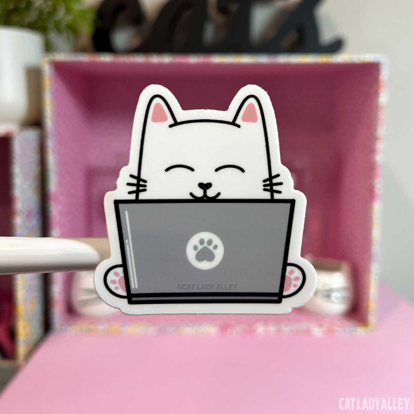 smiling cat using laptop sticker