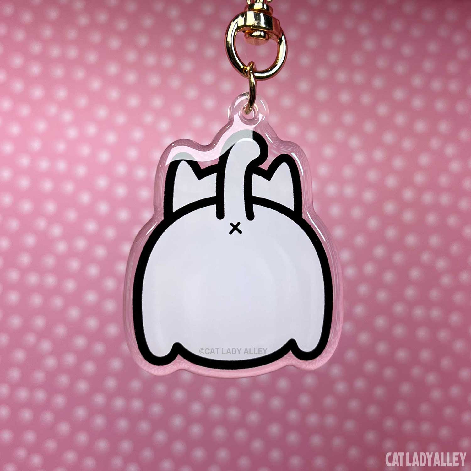 white cat butt keychain