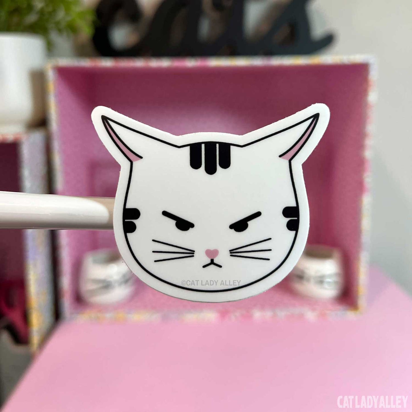 angry tabby cat sticker with airplane ears