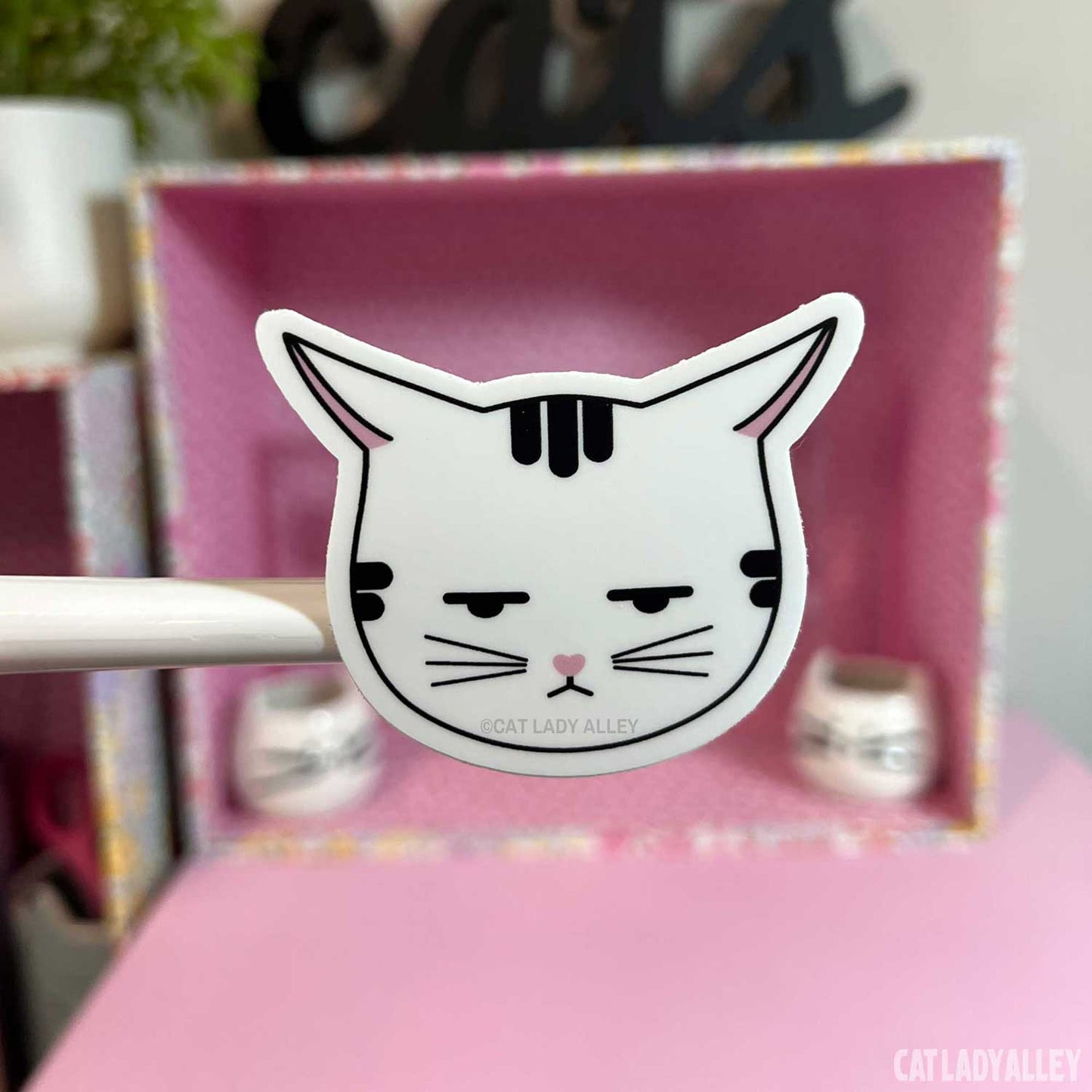 annoyed tabby cat sticker with airplane ears