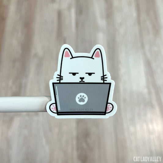 annoyed cat using laptop sticker