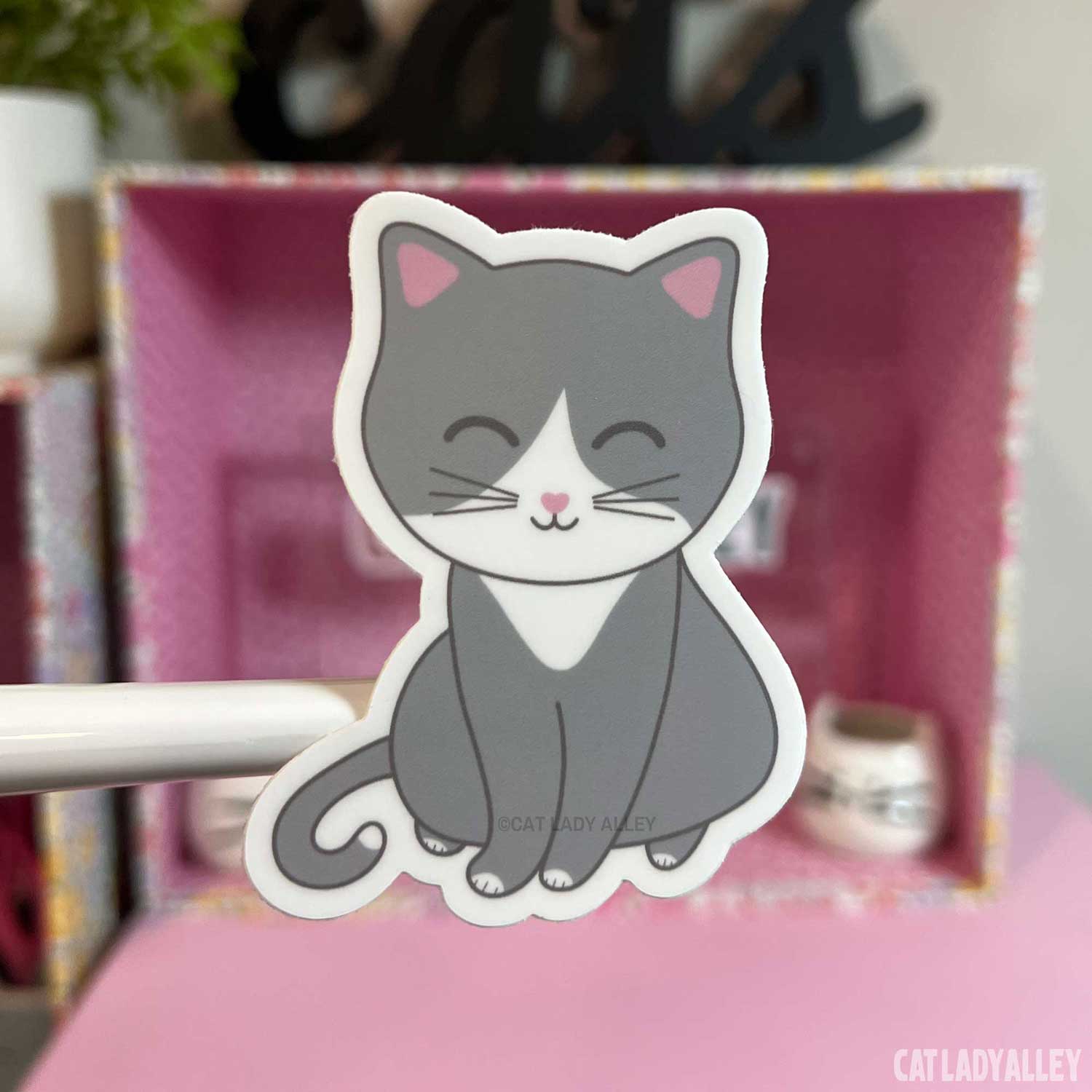 gray and white cat sticker