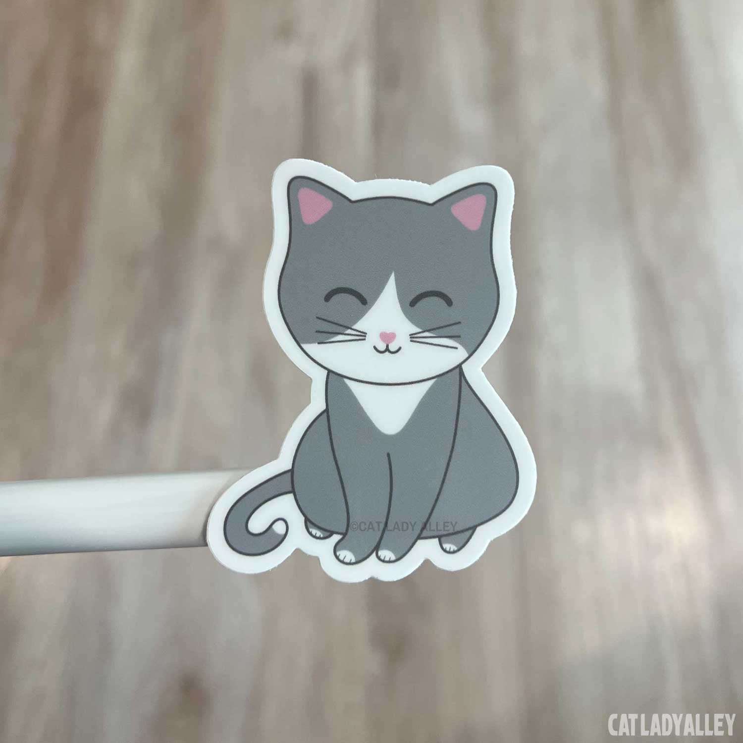 gray and white cat sticker