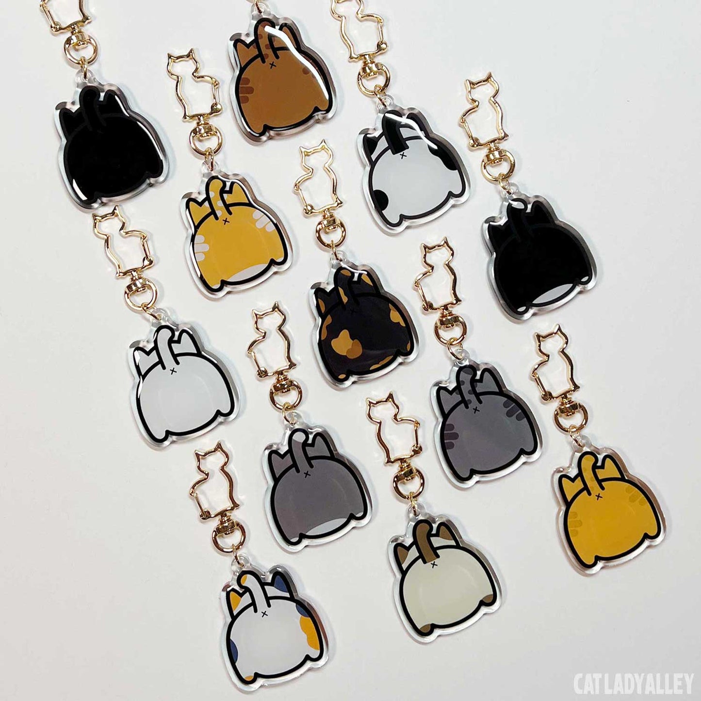 set of cat butt keychains