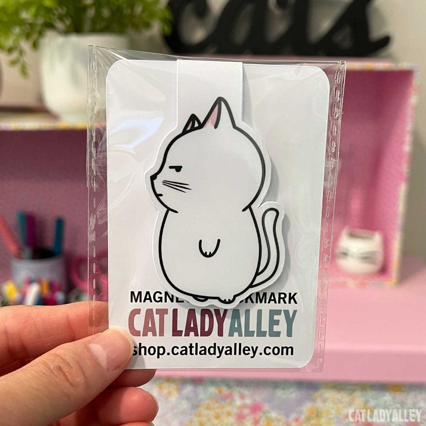 white cat magnetic bookmark in packagin