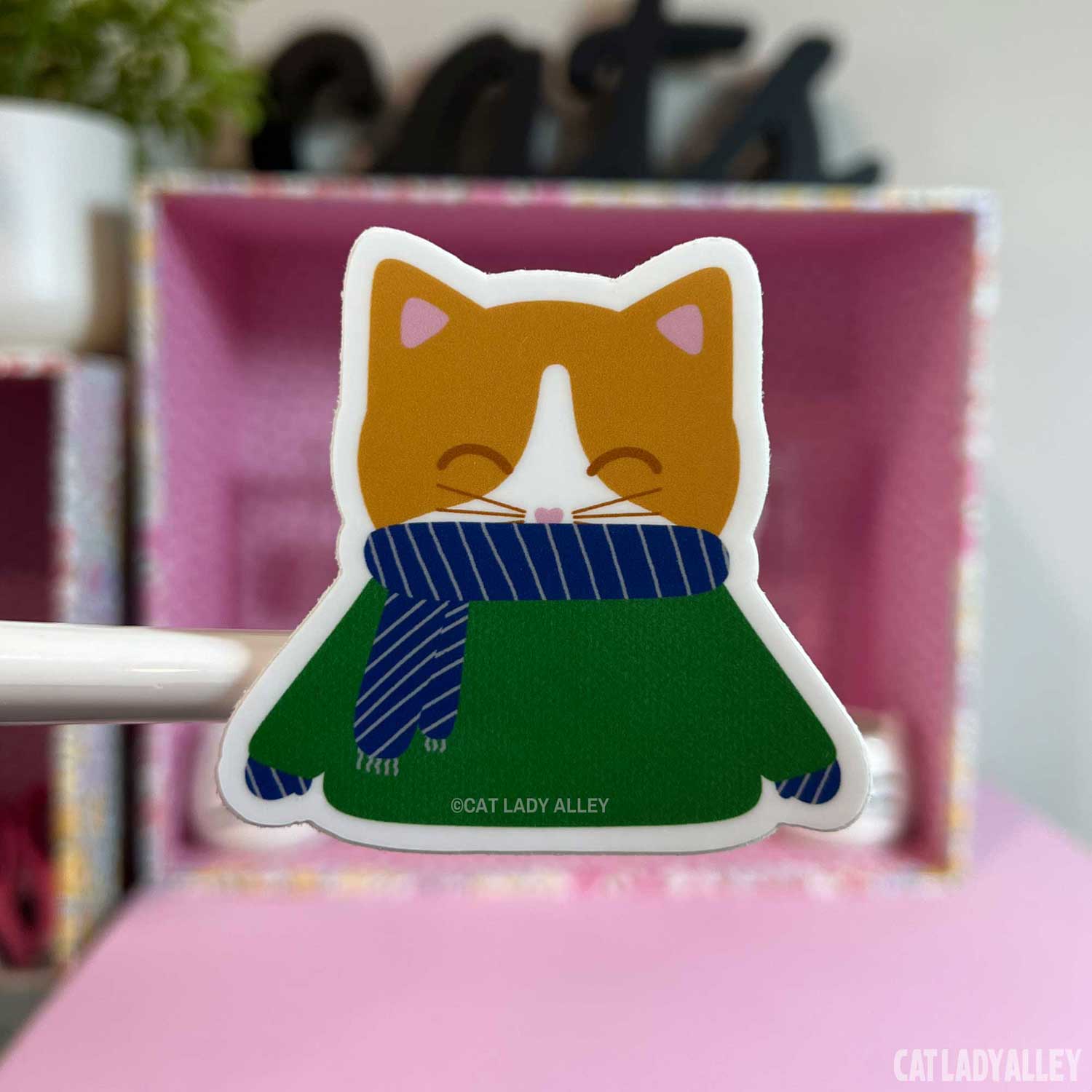 ginger and white cat in sweater sticker