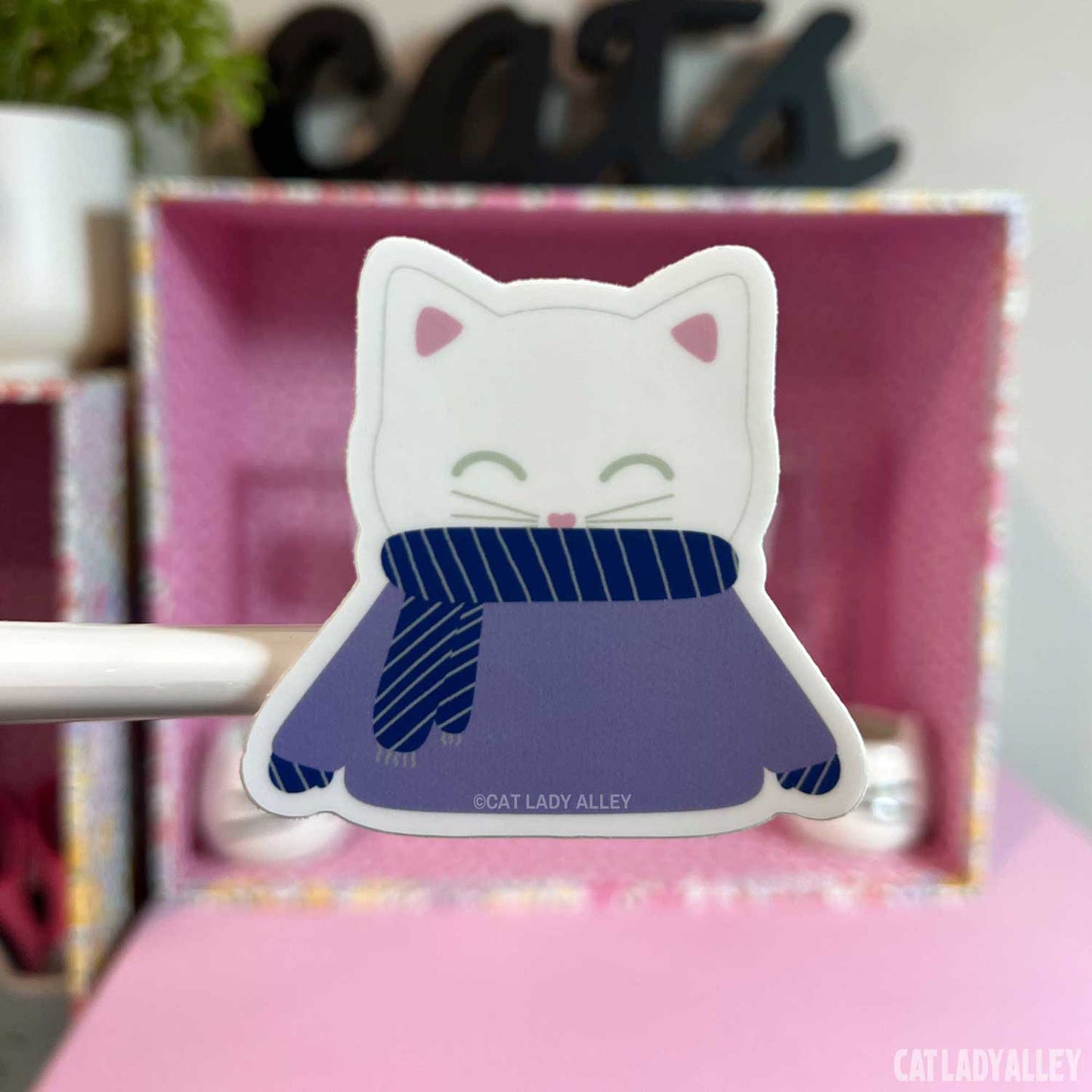 white cat in sweater sticker