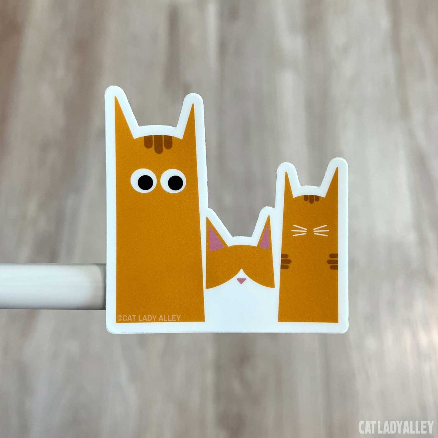 three orange cats sticker