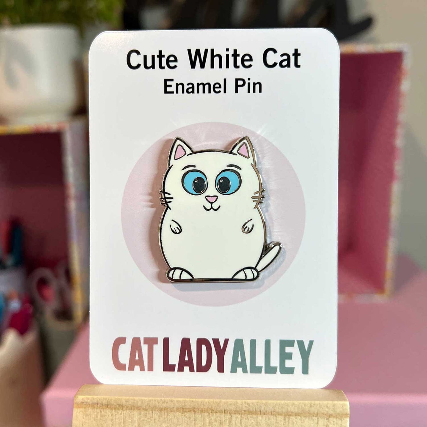 white cat with blue eyes hard enamel pin